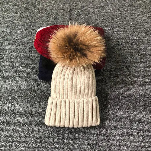 Stay warm and stylish: winter hat with fur pom pom - MAGNET MARKET